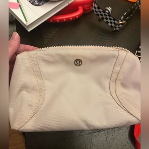Lululemon make up bag, color is light pink.